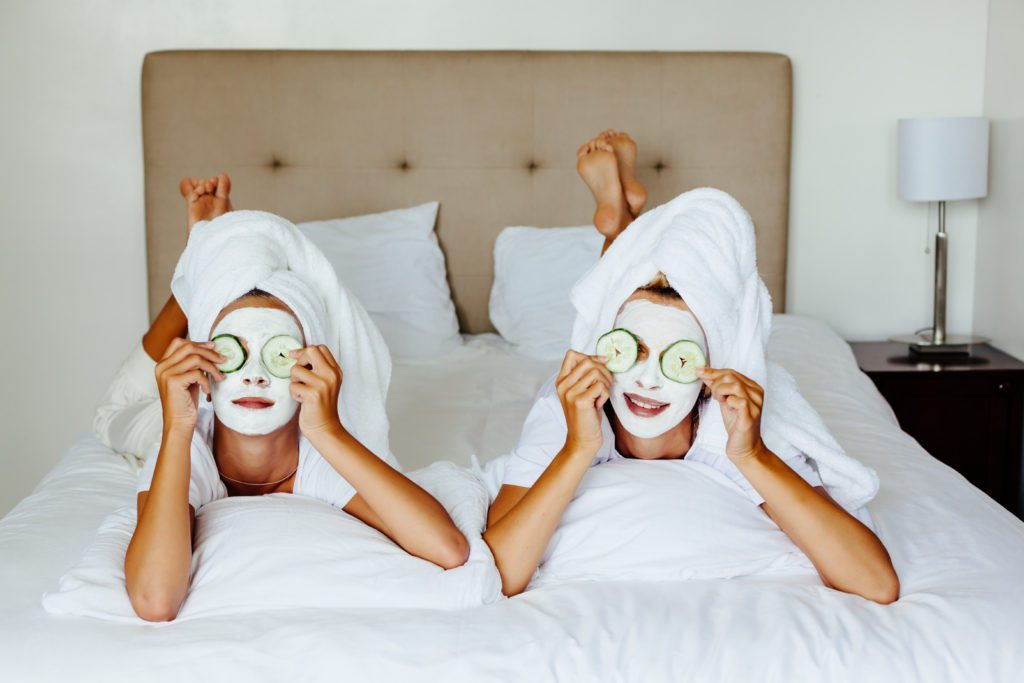 Two women with face masks on their faces