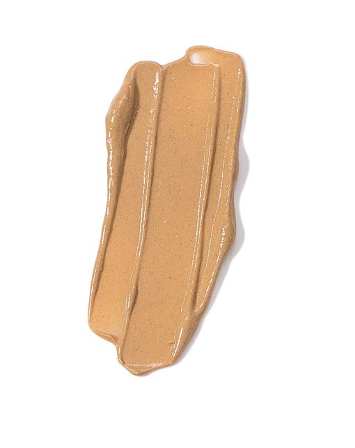 A piece of brown plastic with some tan paint on it